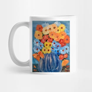 Some abstract vibrant colorful flowers in a glass vase with silver accent . Mug